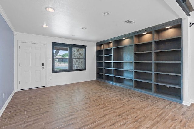 1515 Mearns Meadow Blvd, Austin, TX 78758 - spare room featuring baseboards, crown molding, wood finished floors, and recessed lighting