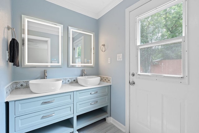 1515 Mearns Meadow Blvd, Austin, TX 78758 - full bathroom with double vanity, plenty of natural light, and ornamental molding