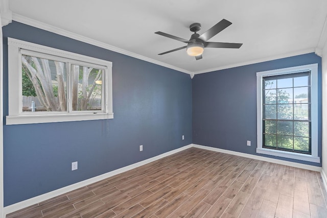 1515 Mearns Meadow Blvd, Austin, TX 78758 - empty room featuring baseboards, wood finished floors, ceiling fan, and ornamental molding