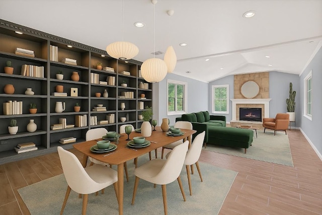 1515 Mearns Meadow Blvd, Austin, TX 78758 - dining area with wood finished floors, lofted ceiling, recessed lighting, a fireplace, and baseboards