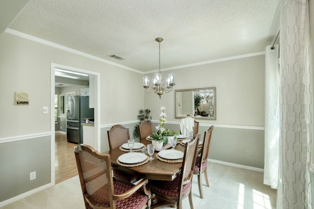1604 W Creek Loop, Round Rock, TX 78681 - dining space featuring a chandelier, a textured ceiling, and crown molding