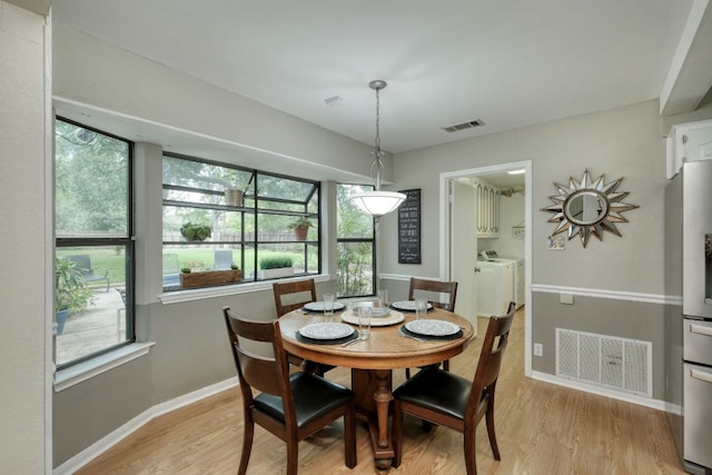 1604 W Creek Loop, Round Rock, TX 78681 - dining space with light wood-type flooring and washer and dryer