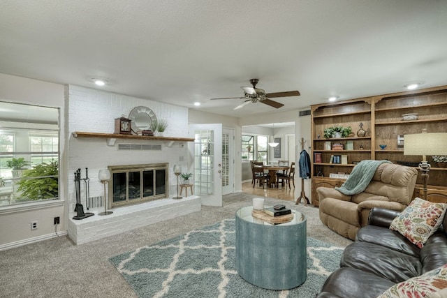 1604 W Creek Loop, Round Rock, TX 78681 - carpeted living room featuring ceiling fan, a fireplace, and recessed lighting