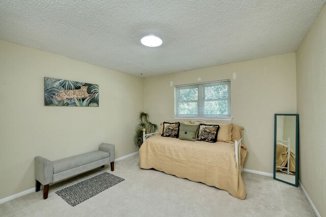 1604 W Creek Loop, Round Rock, TX 78681 - bedroom with carpet flooring and a textured ceiling