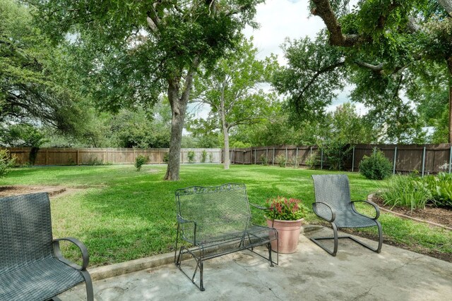 1604 W Creek Loop, Round Rock, TX 78681 - fenced backyard featuring a patio area