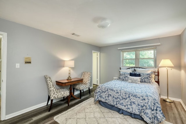 1604 W Creek Loop, Round Rock, TX 78681 - bedroom with wood finished floors and baseboards