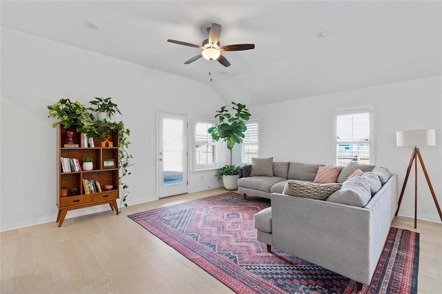 200 Ottaviano Way, Hutto, TX 78634 - living room featuring healthy amount of natural light, ceiling fan, vaulted ceiling, and light wood finished floors