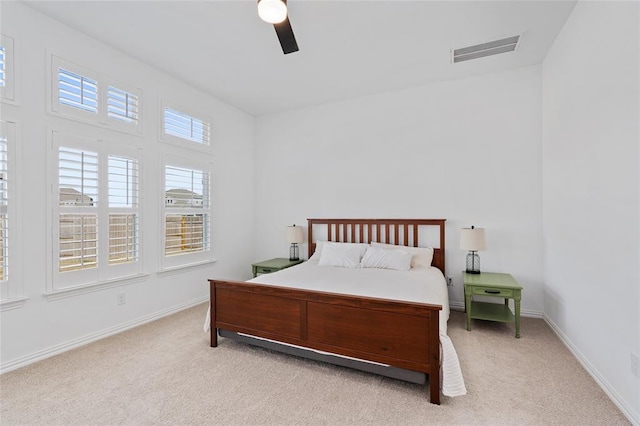 200 Ottaviano Way, Hutto, TX 78634 - bedroom with light carpet, ceiling fan, and baseboards