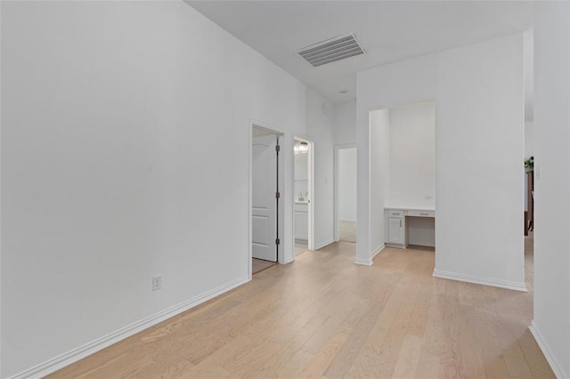 200 Ottaviano Way, Hutto, TX 78634 - spare room featuring light wood-style flooring and baseboards