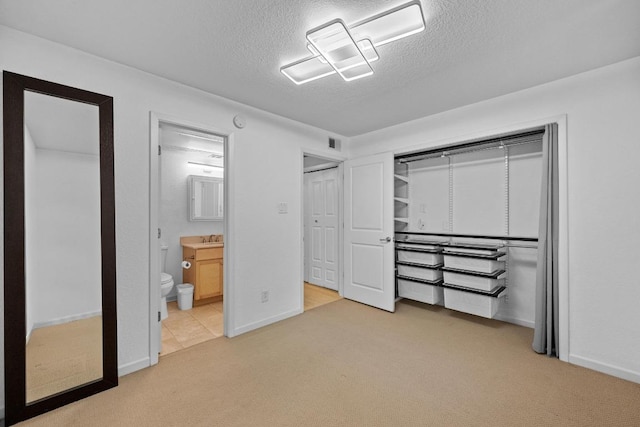 3204 Menchaca Rd Unit 405, Austin, TX 78704 - unfurnished bedroom with carpet floors, a textured ceiling, and ensuite bathroom
