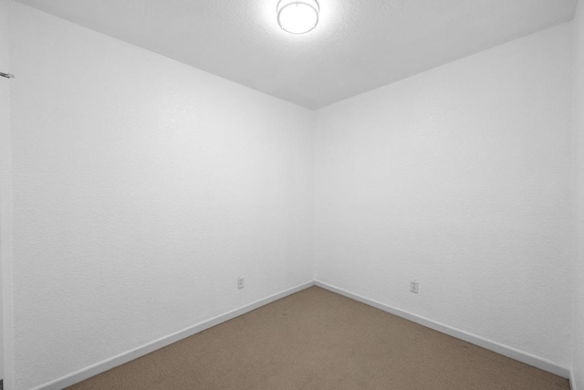 3204 Menchaca Rd Unit 405, Austin, TX 78704 - spare room featuring light carpet and baseboards