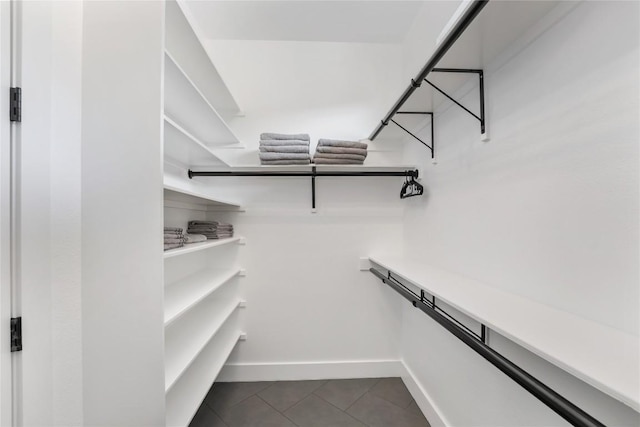 11204 Oak St, Jonestown, TX 78645 - walk in closet with dark tile patterned flooring