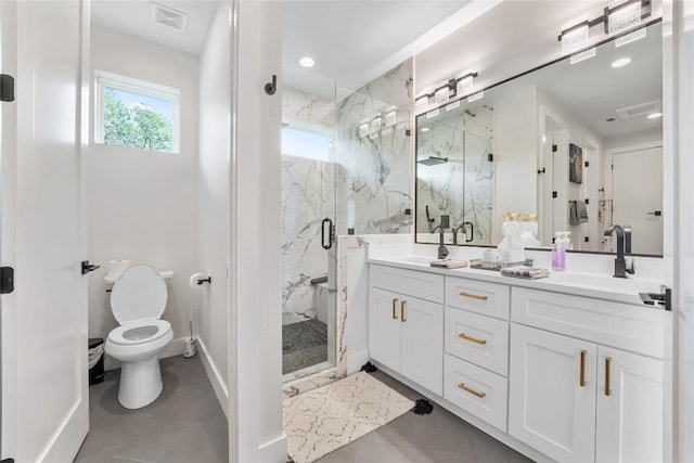 11204 Oak St, Jonestown, TX 78645 - full bath with plenty of natural light, toilet, a marble finish shower, double vanity, and recessed lighting