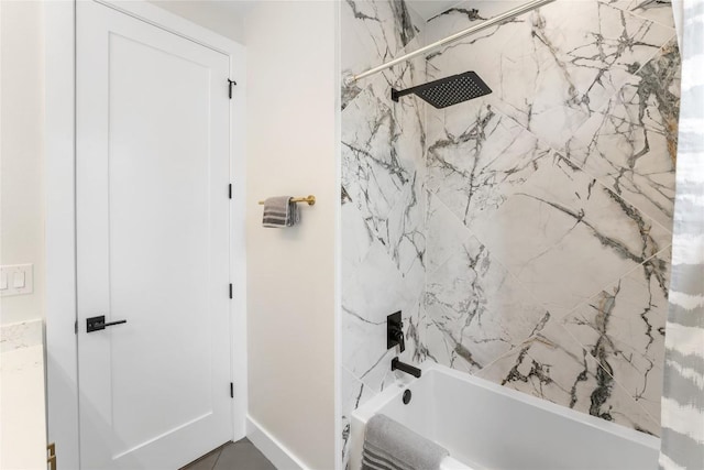 11204 Oak St, Jonestown, TX 78645 - bathroom featuring shower / tub combo with curtain and baseboards