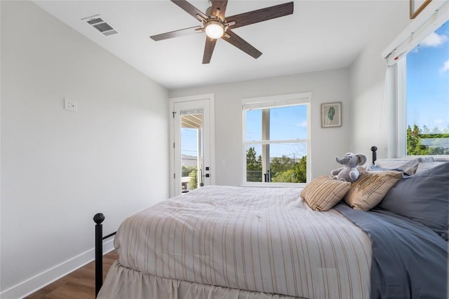 11204 Oak St, Jonestown, TX 78645 - bedroom featuring access to outside, wood finished floors, baseboards, and ceiling fan