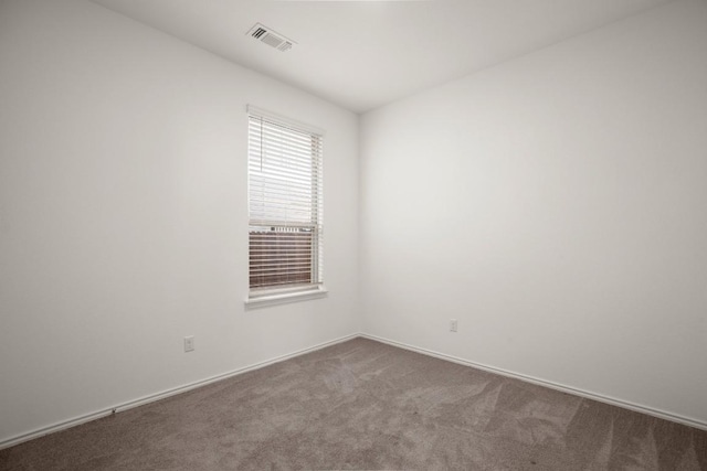 637 Pickrell Loop, Liberty Hill, TX 78642 - empty room with dark carpet and baseboards