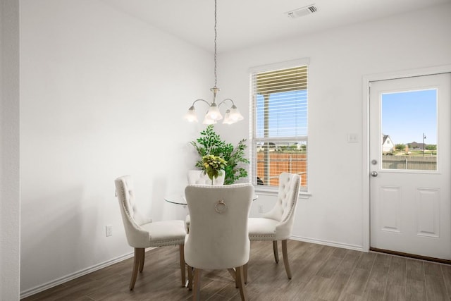 637 Pickrell Loop, Liberty Hill, TX 78642 - dining area with a chandelier and wood finished floors