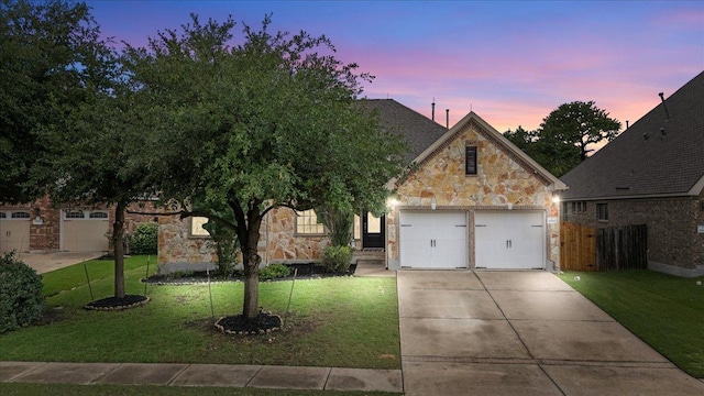 2997 Agave Loop, Round Rock, TX 78681 - view of front of property with stone siding, concrete driveway, and a garage