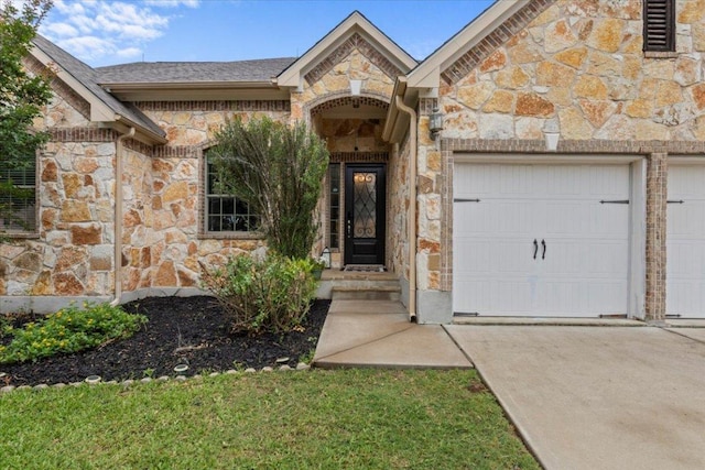 2997 Agave Loop, Round Rock, TX 78681 - entrance to property featuring stone siding, a garage, and driveway