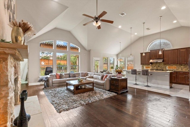 2997 Agave Loop, Round Rock, TX 78681 - living room featuring a ceiling fan, hardwood / wood-style floors, high vaulted ceiling, and recessed lighting