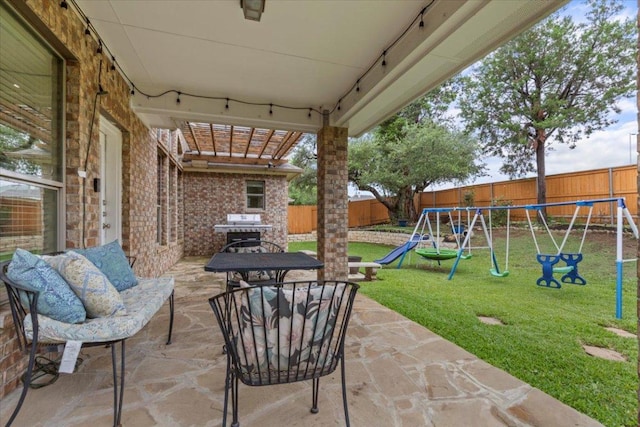 2997 Agave Loop, Round Rock, TX 78681 - fenced backyard featuring a playground, a patio, and grilling area