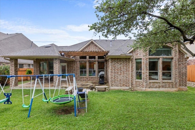 2997 Agave Loop, Round Rock, TX 78681 - rear view of property featuring a playground, brick siding, and roof with shingles