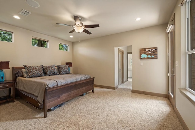 148 Oak Plaza Dr, Georgetown, TX 78628 - bedroom with light colored carpet, multiple windows, recessed lighting, a ceiling fan, and baseboards