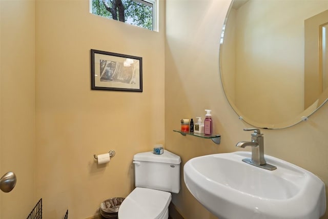 148 Oak Plaza Dr, Georgetown, TX 78628 - half bathroom featuring a sink and toilet