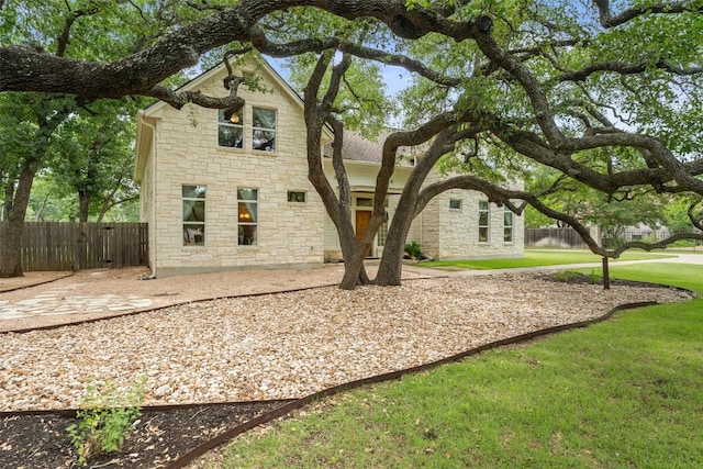 148 Oak Plaza Dr, Georgetown, TX 78628 - rear view of property featuring stone siding
