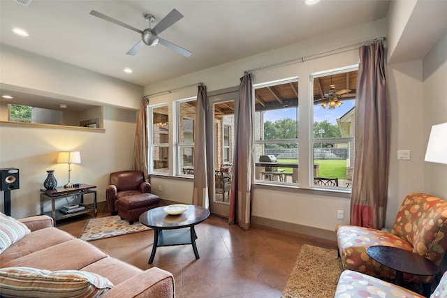 148 Oak Plaza Dr, Georgetown, TX 78628 - living area with a ceiling fan, tile patterned flooring, recessed lighting, and baseboards