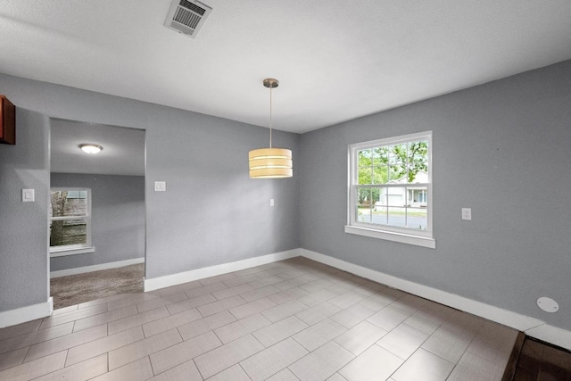 5601 Samuel Huston Ave, Austin, TX 78721 - unfurnished room featuring baseboards
