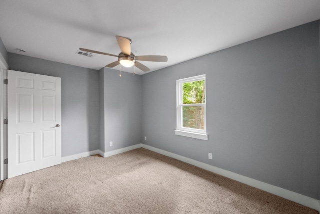 5601 Samuel Huston Ave, Austin, TX 78721 - unfurnished bedroom featuring carpet floors, baseboards, and a ceiling fan