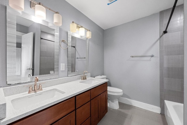 5601 Samuel Huston Ave, Austin, TX 78721 - bathroom with double vanity, tile patterned floors, and shower / bath combination