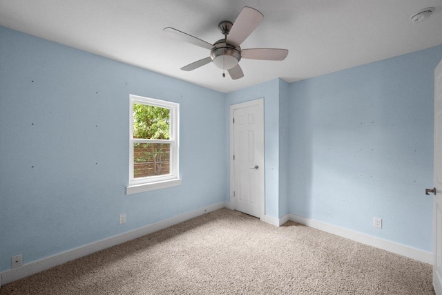 5601 Samuel Huston Ave, Austin, TX 78721 - spare room with light colored carpet, a ceiling fan, baseboards, and a smoke detector
