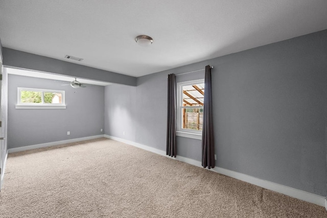 5601 Samuel Huston Ave, Austin, TX 78721 - empty room featuring carpet and a ceiling fan