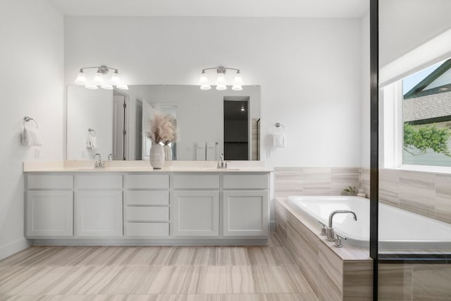 256 Smoke Tree Cir, Dripping Springs, TX 78620 - full bath featuring double vanity and a garden tub