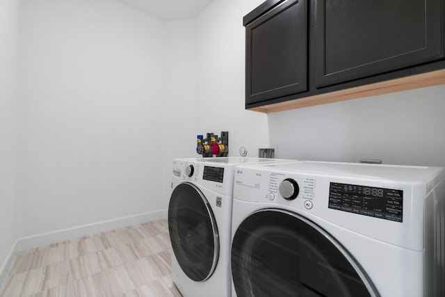 256 Smoke Tree Cir, Dripping Springs, TX 78620 - laundry area with washing machine and clothes dryer and cabinet space