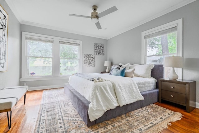3210 Funston St, Austin, TX 78703 - bedroom featuring wood finished floors, crown molding, baseboards, and a ceiling fan