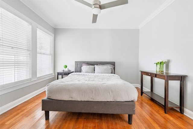 3210 Funston St, Austin, TX 78703 - bedroom with crown molding, light wood-style floors, multiple windows, and baseboards