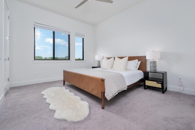 2050 Lohmans Spur Unit 1401, Austin, TX 78734 - bedroom featuring baseboards, carpet, and a ceiling fan