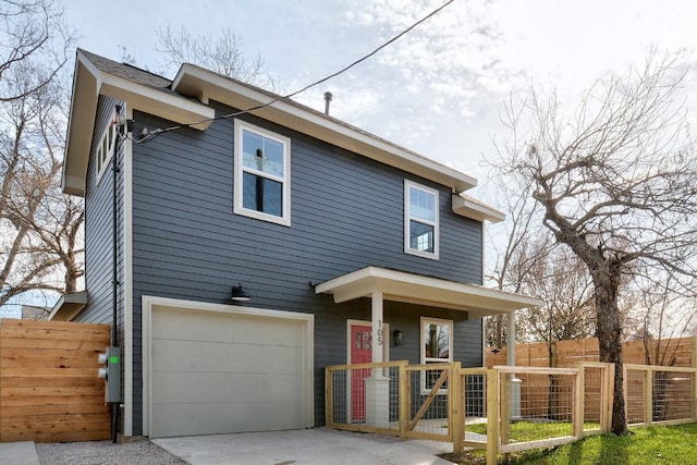105 Elkhart St Unit 3, Austin, TX 78702 - view of front of home with a garage, driveway, and a gate