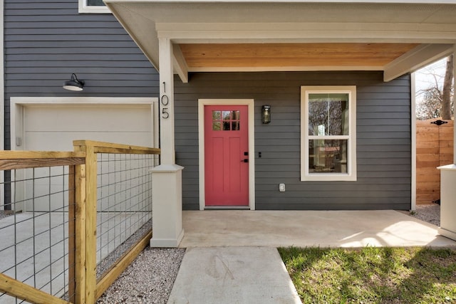 105 Elkhart St Unit 3, Austin, TX 78702 - doorway to property with covered porch and an attached garage