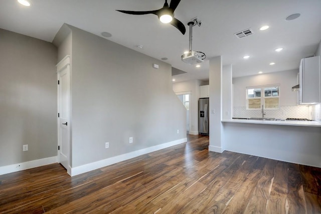 105 Elkhart St Unit 3, Austin, TX 78702 - unfurnished living room with dark wood-style flooring, ceiling fan, baseboards, recessed lighting, and a sink