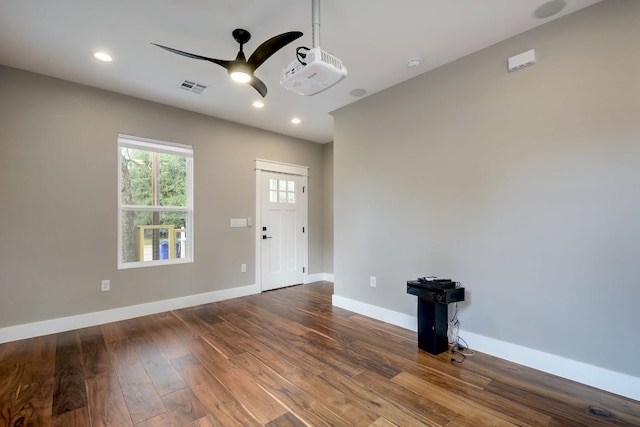 105 Elkhart St Unit 3, Austin, TX 78702 - empty room featuring ceiling fan, dark wood finished floors, baseboards, recessed lighting, and a smoke detector