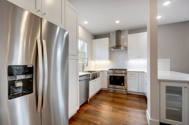 105 Elkhart St Unit 3, Austin, TX 78702 - kitchen featuring stainless steel appliances, wall chimney exhaust hood, beverage cooler, a sink, and dark wood-style floors