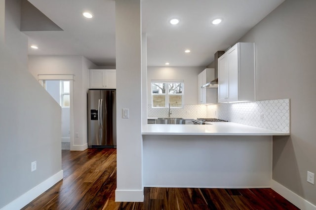 105 Elkhart St Unit 3, Austin, TX 78702 - kitchen with stainless steel fridge, backsplash, a sink, white cabinetry, and dark wood finished floors