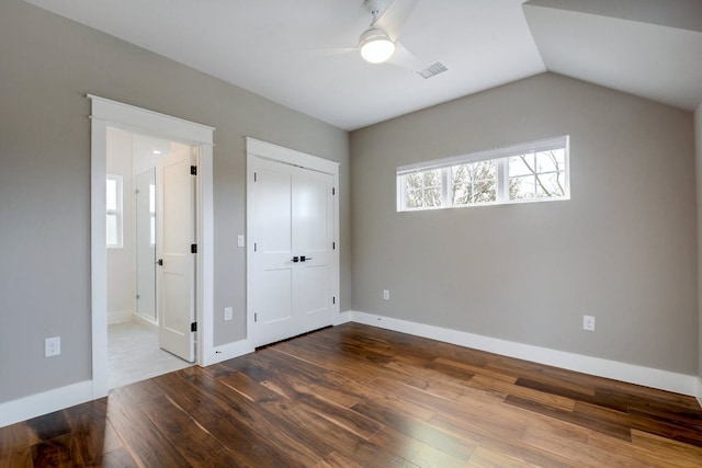 105 Elkhart St Unit 3, Austin, TX 78702 - unfurnished bedroom featuring hardwood / wood-style floors, baseboards, vaulted ceiling, ceiling fan, and ensuite bathroom