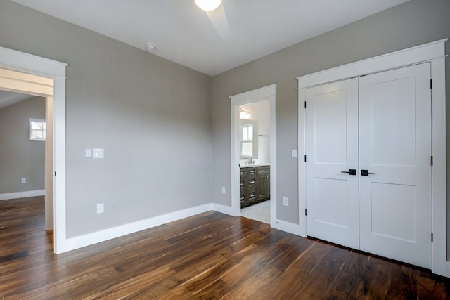 105 Elkhart St Unit 3, Austin, TX 78702 - unfurnished bedroom with dark wood-style flooring, baseboards, a closet, and ensuite bathroom