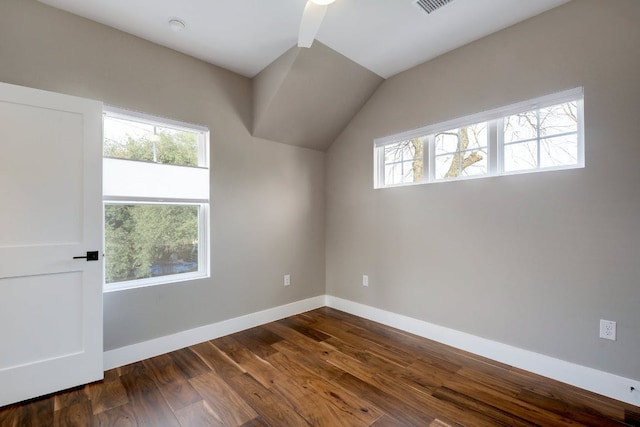 105 Elkhart St Unit 3, Austin, TX 78702 - spare room featuring plenty of natural light, baseboards, dark wood finished floors, and lofted ceiling