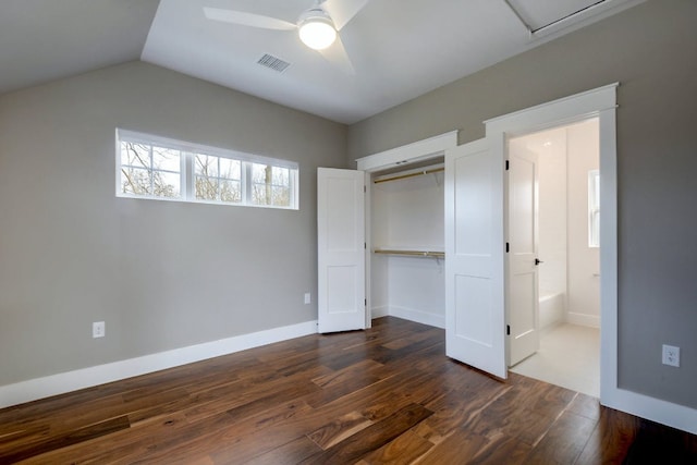 105 Elkhart St Unit 3, Austin, TX 78702 - unfurnished bedroom with dark wood finished floors, a closet, vaulted ceiling, a ceiling fan, and baseboards